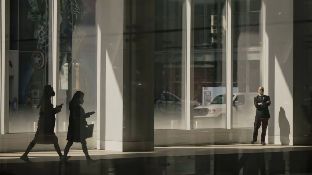 Professionals outside a commercial building representing office tenant advisory needs